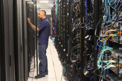 person installing supercomputer